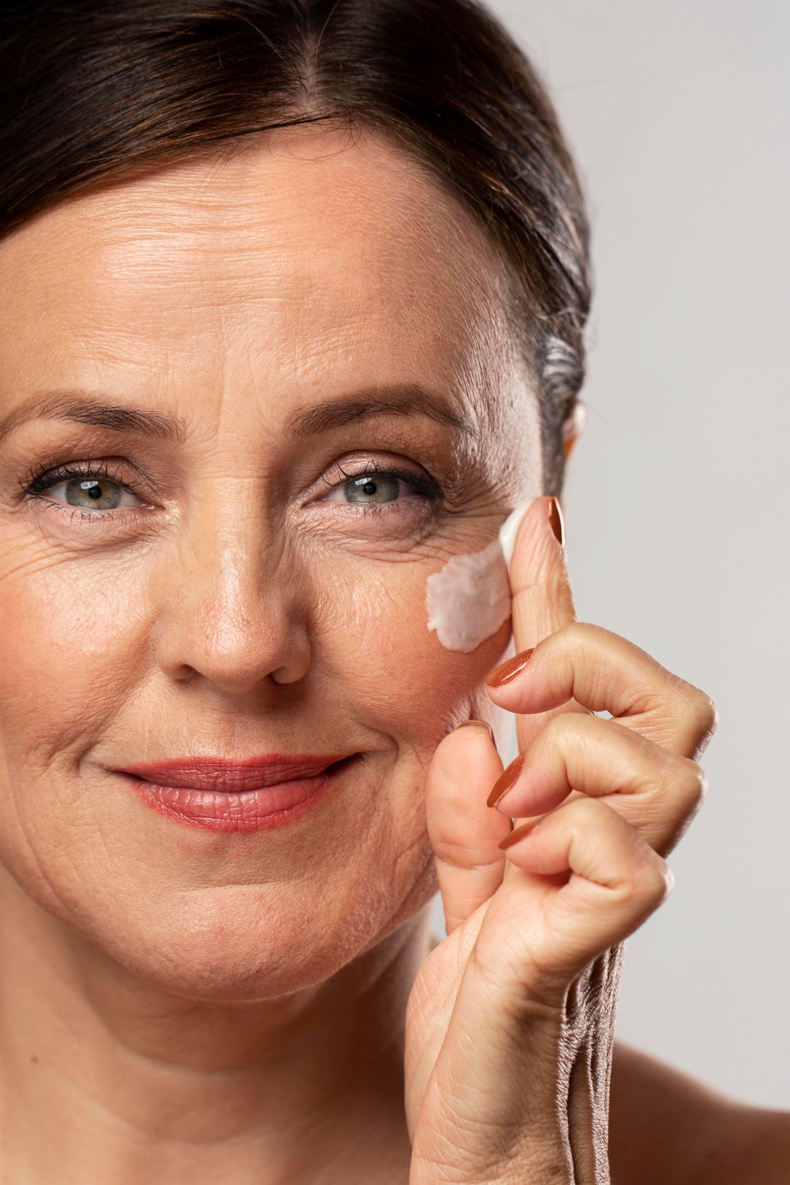 Cooling eye cream applied to reduce under-eye puffiness