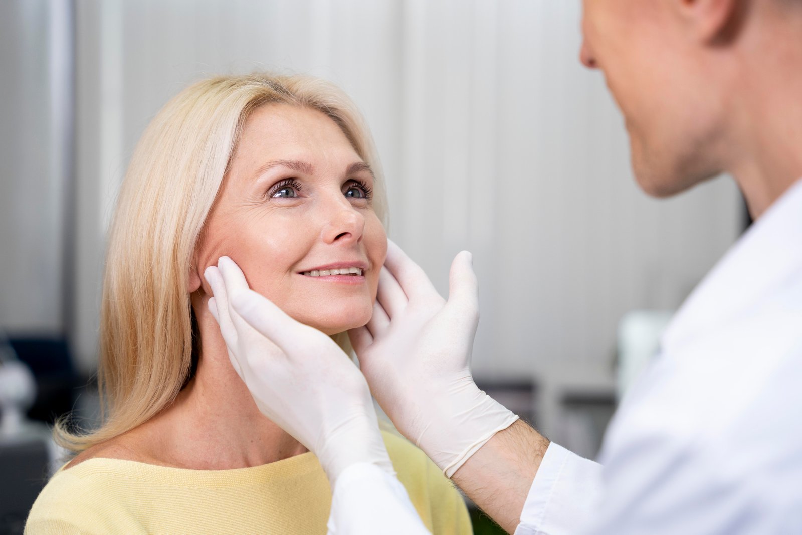 Woman applying anti-aging serum to her face
