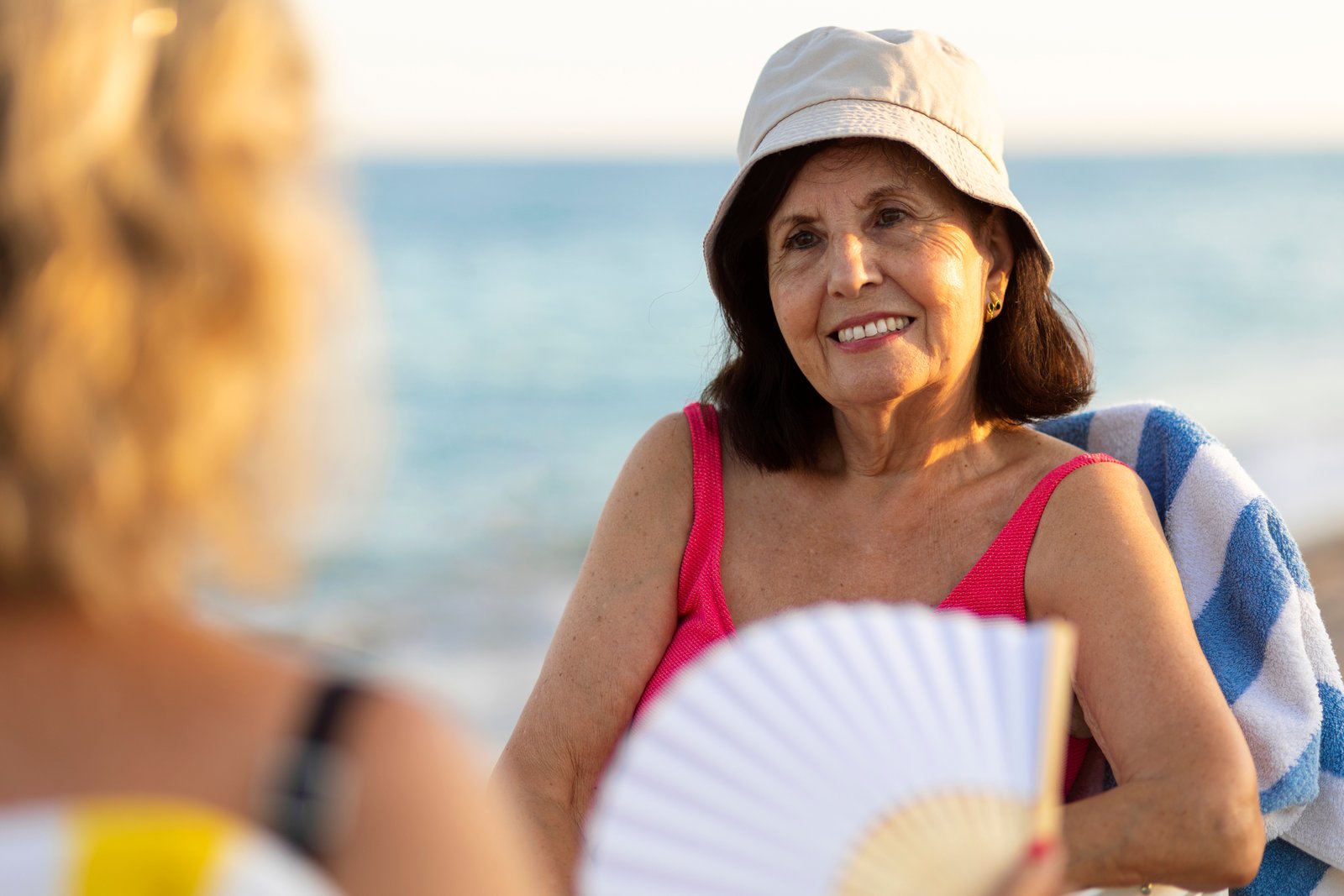 Woman applying sunscreen to her face